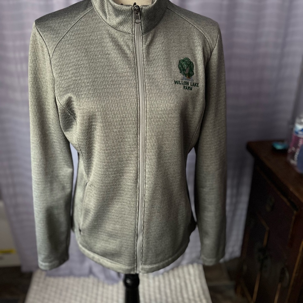 Port Authority Women's Jacket in Gray. Full zip front , a medium weight